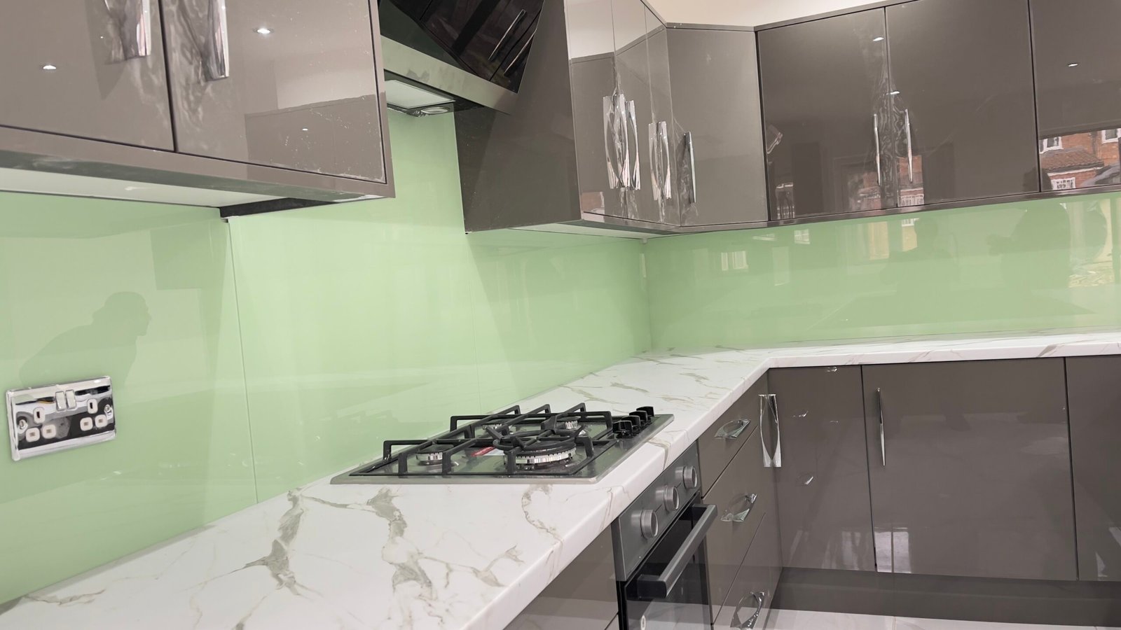 Anthracite kitchen with pale green splashback